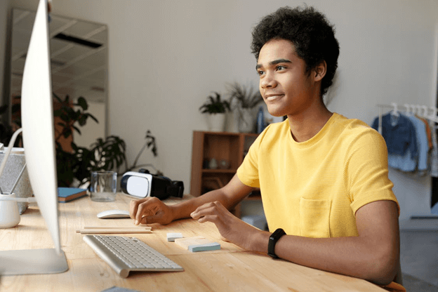 A man learning a language online.