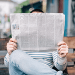 A man reading the headlines.