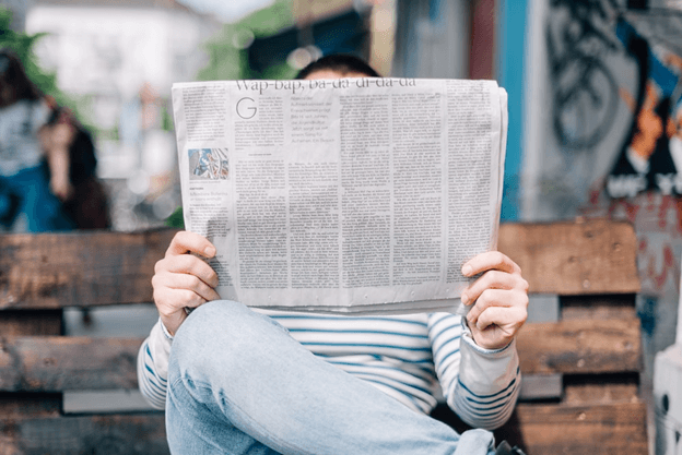 A man reading the headlines.